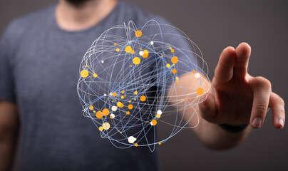 A man interacts with a digital sphere representing global network connections and data...