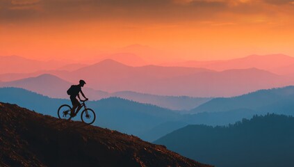Fototapeta premium Man on mountain bike sunset silhouette