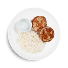 A plate of rice and meatballs served on a clean white background