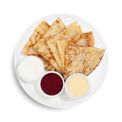 A plate with pancakes and sauces on a white background