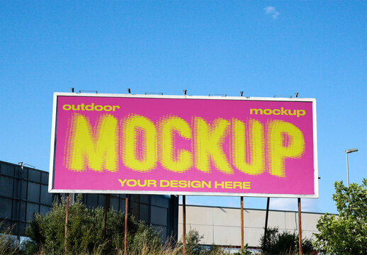 Blank billboard mockup displayed outdoors in a clear blue sky