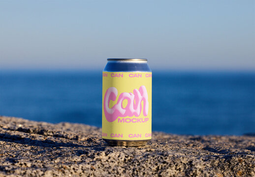 Blank Can Mockup Placed on Rocky Surface. PSD mockup template ready for your logo design