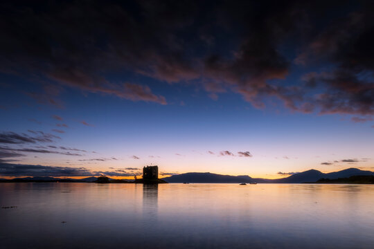 Scenic view of Castle Stalker on Loch Linnhe at sunset, Scotland