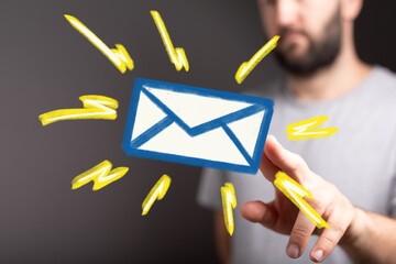 Hand holding a digital email icon.  Modern communication concept.