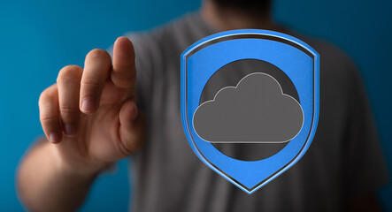 Image of a hand reaching towards a cloud icon protected by a shield, symbolizing secure cloud data.
