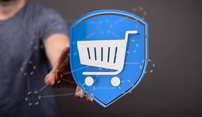 Image of a hand holding a digital shopping cart protected by a shield.  Represents secure online...