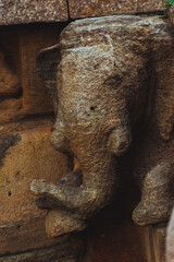 Ancient temple wall carvings of elephant head in Badami, Karnataka, India, reflecting Indian...