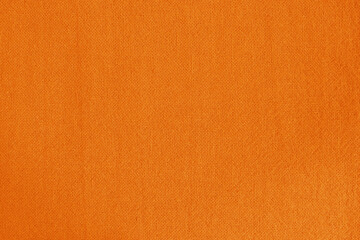 Orange fabric cloth texture for background, natural textile pattern.