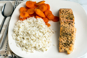 seasoned salmon  with rice and carrots