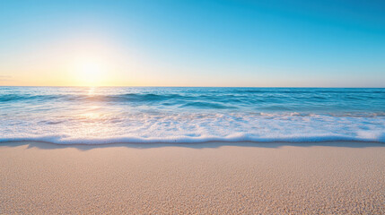The ocean is calm and the sun is setting, creating a beautiful
