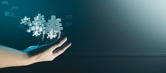 hand of businessman interactive touching a holographic of transaction financial network data...
