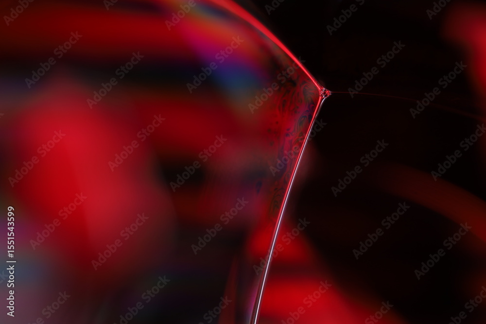Fototapete red reflections of liquid in macro, red liquid surface, bubbles in macro, connection of bubbles in m