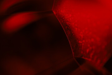 Red reflections of liquid in macro, red liquid surface, bubbles in macro, connection of bubbles in...