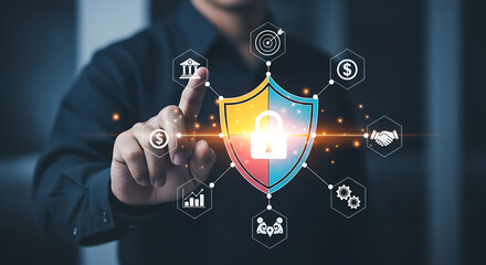 Businessman touching a digital shield representing financial data protection and cyber security