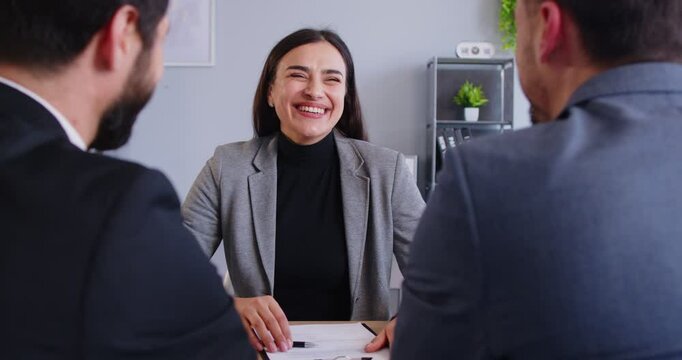 Happy female solicitor meets, woman lawyer, broker, consultant, real estate agent, thanking for consultation, positive business partners giving handshake at meeting in office, satisfied negotiations