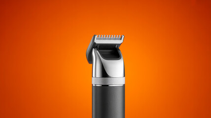 A product photograph of a black and silver beard trimmer against a solid orange background.