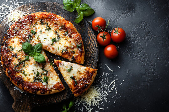 Pizza margherita with basilia leaves. Pizzeria theme.