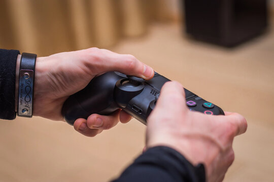 gaming game play tv fun gamer gamepad guy controller video console playing player holding hobby playful enjoyment view concept - stock image