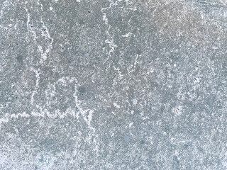 Weathered Concrete Wall Texture with Grainy Surface - A grainy, weathered concrete wall texture with natural aging marks and light stains. 