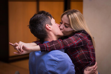 the hot blondie girl hugs and kisses a guy