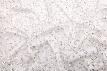 Luxurious bridal white crystal lace on matching silk satin base—high-fashion fabric texture perfect for couture, bridalwear, or luxury design projects. Sophisticated, shimmering, and stylish.