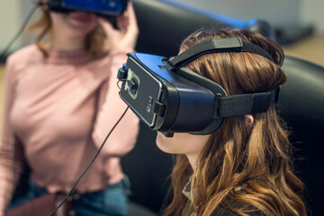 girl in the VR glasses looks on the sides