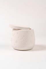 plaster glass on a white background. Making dishes from gypsum.