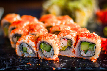 Girl eats Japanese vegetarian rolls