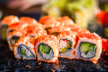 Girl eats Japanese vegetarian rolls