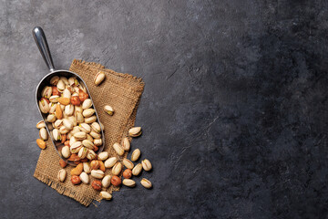 A vibrant assortment of various nuts, including almonds, walnuts, hazelnuts, cashews, and pistachios