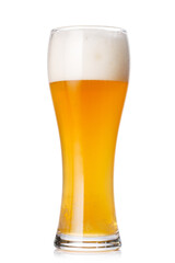 A glass of beer with a golden hue and frothy head, isolated on a clean white background