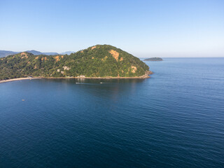 Beautiful island in the middle of the sea illuminated by the setting sun