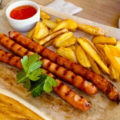 dish of grilled sausage and French fries