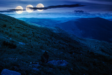 wonderful mountain landscape for travel with green hill in summer at night. nature scenery with scenic view in to the distant valley in dappled full moon light. hiking through highland. fake news