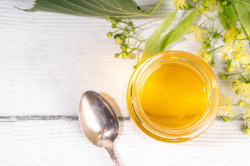 Linden jam, transparent golden floral jam, organic unusual herbal preserve sweets in small jar,...