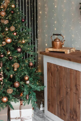 Home New Year's interior. Christmas tree with gifts, decorated with garlands in the kitchen. Cozy...