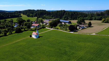 Peaceful Rural Landscape With a Small Church Surrounded by Fields and Homes in Germany