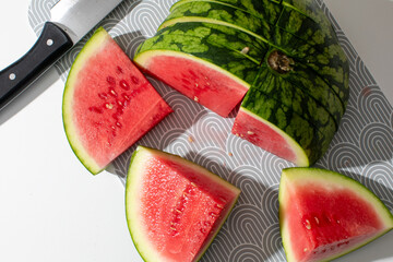 Sliced watermelon gleams under summer sun, evoking juicy picnic nostalgia and spontaneous...
