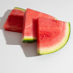 Juicy watermelon slices shimmer under summer solstice light, evoking picnic vibrancy and evanescent moments of midsummer revelry