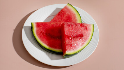 Juicy watermelon wedges gleam under sun, echoing summer solstice feasts and picnics, refreshing...