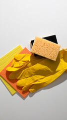 Yellow gloves, vibrant sponges evoke spring cleaning fervor, Hygge-inspired freshness sings,...