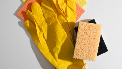 Sunny yellow gloves poised for the spring clean ritual, echoing Dia del Trabajo and whimsical...