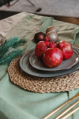 Serving a festive Christmas table in Scandinavian style. Decor on the table before the holiday.