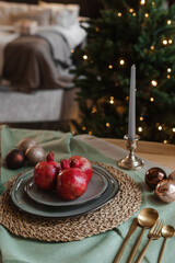 Serving a festive Christmas table in Scandinavian style. Decor on the table before the holiday.