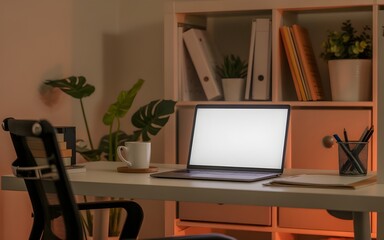 Fototapeta premium Cozy modern home office with laptop, coffee mug, and warm lighting – perfect for remote work