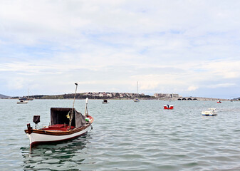 Naklejka premium Wooden fishing boats tied to the shore, Ayvalık