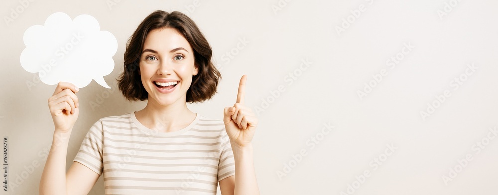 Poster Smiling woman holding blank speech bubble and pointing up against light background with copyspace for text or design, perfect for creative mockup..