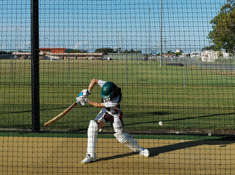 Cricket training and practice in the nets for left handed female cricket player