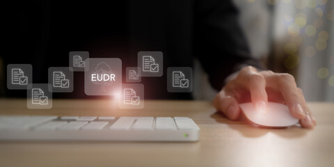 EUDR Compliance Concept. Using a computer mouse with icons of documents and checkmarks, representing verification, traceability and regulatory reporting. Traceability, sustainability and regulation.