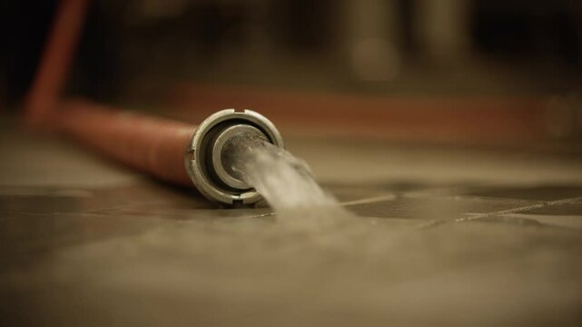 Slow motion shot of a cleaning ball being flushed through a wine tank hose
